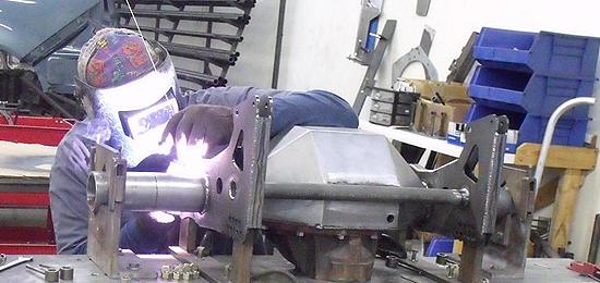 Darren hard at it welding a new fabricated rear end